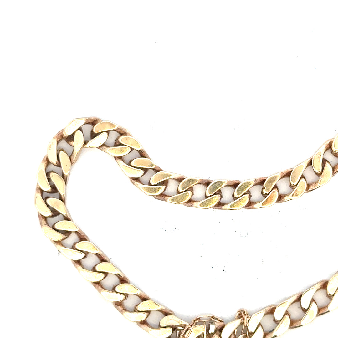 9ct yellow gold curb bracelet weighing 20g, unbranded jewelry with classic linked design, displayed against a neutral background.
