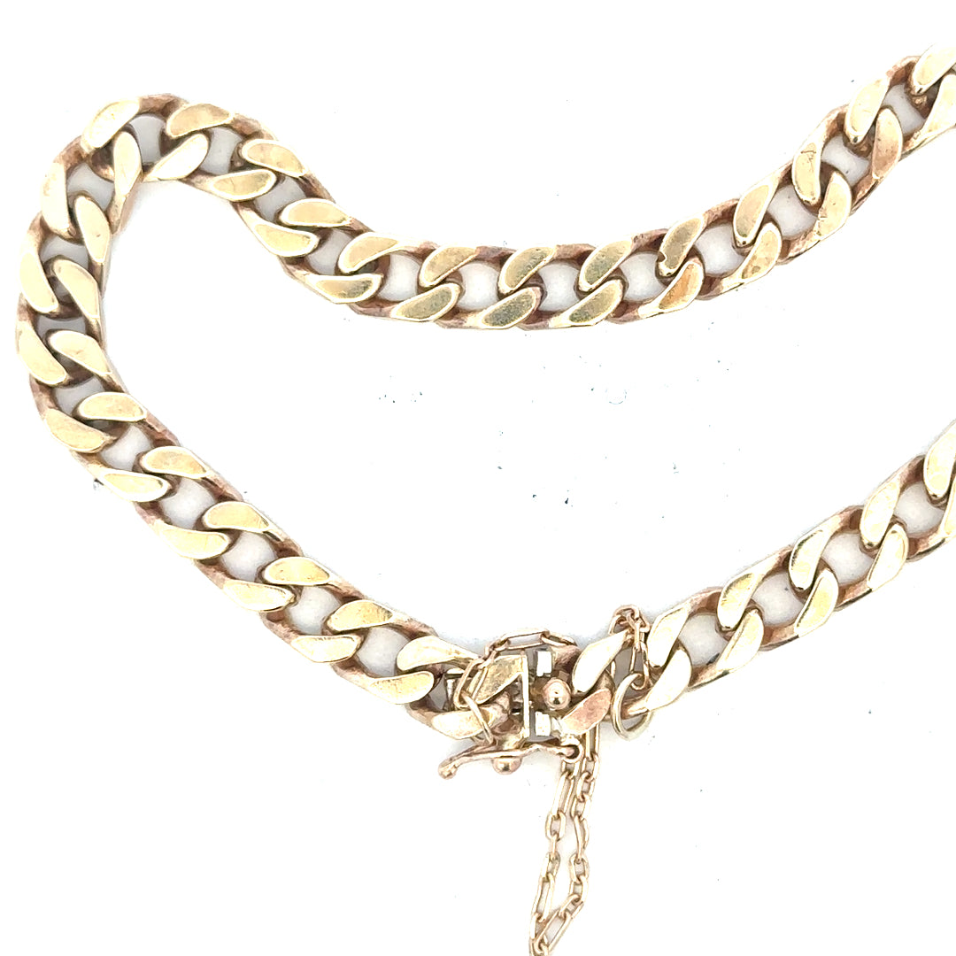 9ct yellow gold curb bracelet with a 20g weight, unbranded, featuring classic chain links, shown in a close-up image.