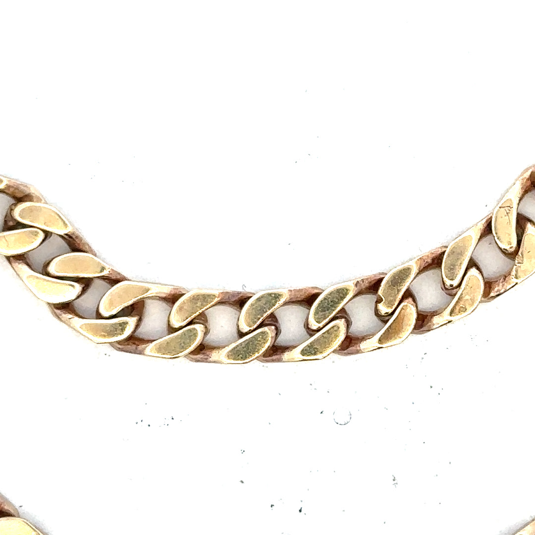 9ct yellow gold curb bracelet, unbranded, 20g, with a classic chain design, shown in a close-up image.