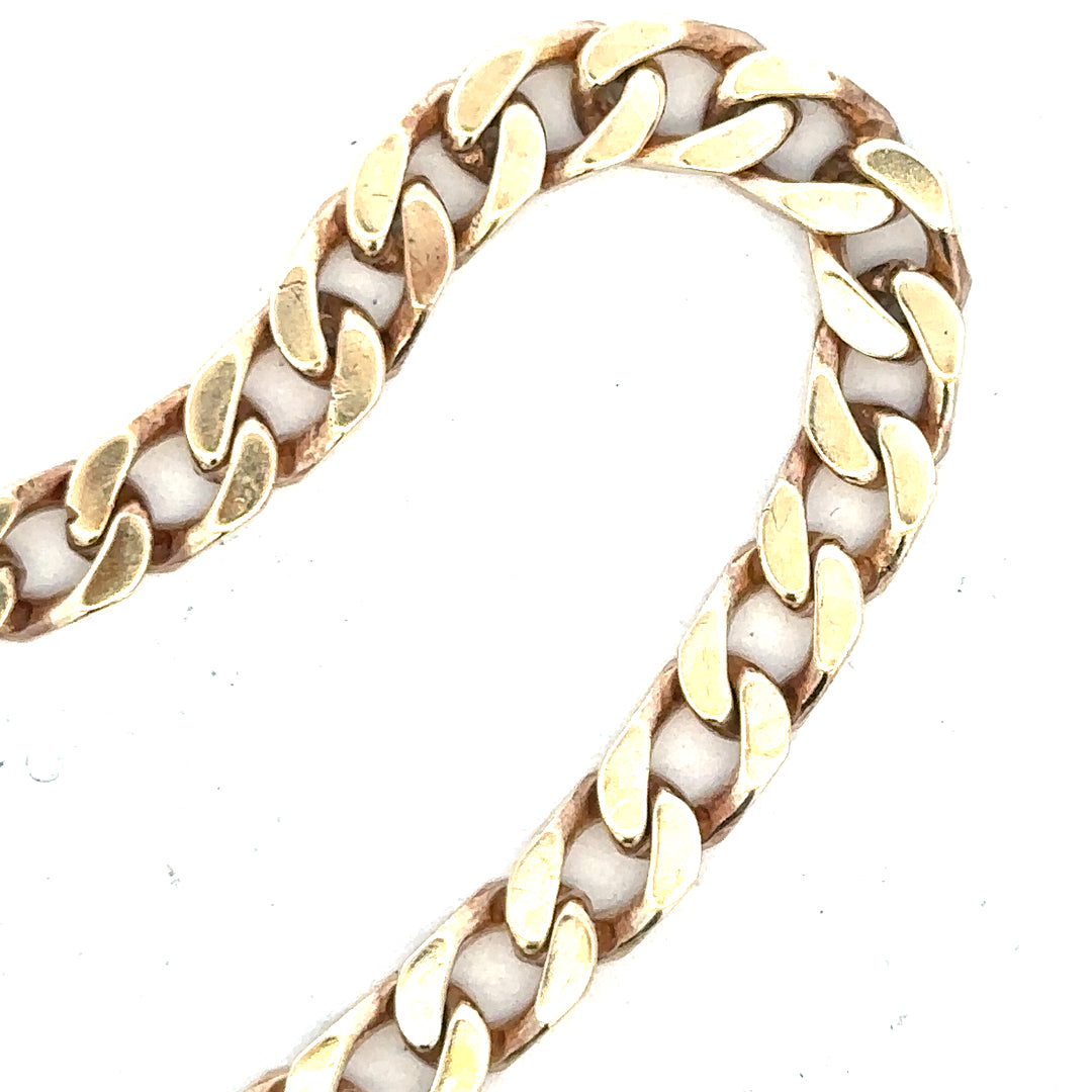 9ct yellow gold curb bracelet weighing 20g, unbranded, featuring classic chain links, displayed on a neutral background.
