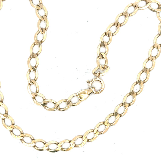 9ct yellow gold curb bracelet weighing 3.9g, unbranded, featuring classic chain links, shown in a close-up view.