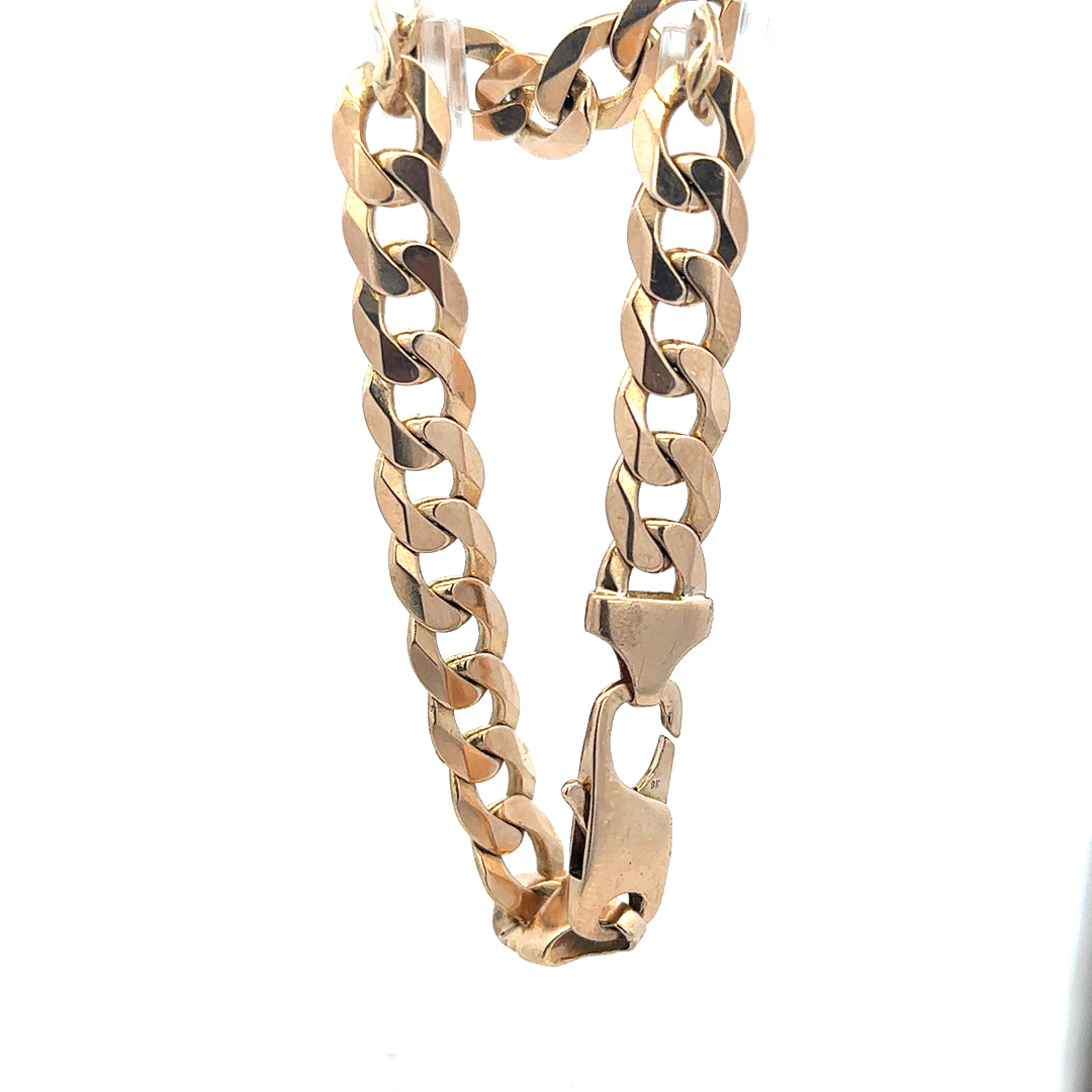 9ct yellow gold curb bracelet weighing 31.9g, unbranded, featuring a classic linked chain design.