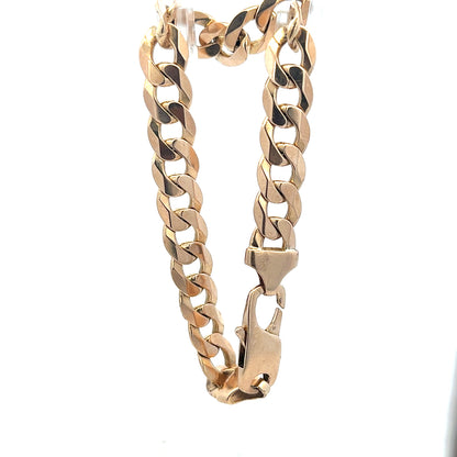 9ct yellow gold curb bracelet weighing 31.9g, unbranded, featuring a classic linked chain design.