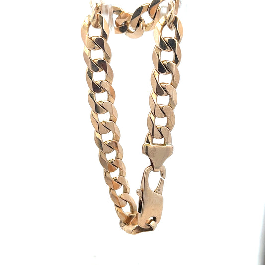 9ct yellow gold curb bracelet weighing 31.9g, unbranded, featuring a classic linked chain design.