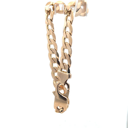 9ct yellow gold curb bracelet weighing 31.9g, unbranded, featuring classic interlinked chain design.