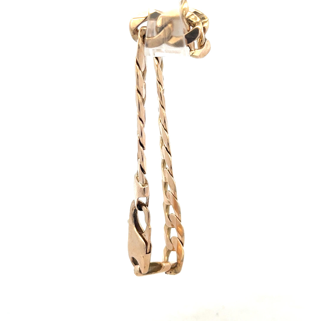 9ct yellow gold curb bracelet with a sturdy chain design, weighing 31.9g, unbranded jewelry piece.