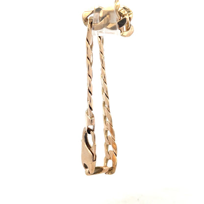 9ct yellow gold curb bracelet with a sturdy chain design, weighing 31.9g, unbranded jewelry piece.