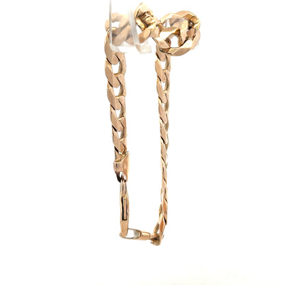 9ct yellow gold curb bracelet with a 31.9g weight, featuring a classic chain design and secure clasp.
