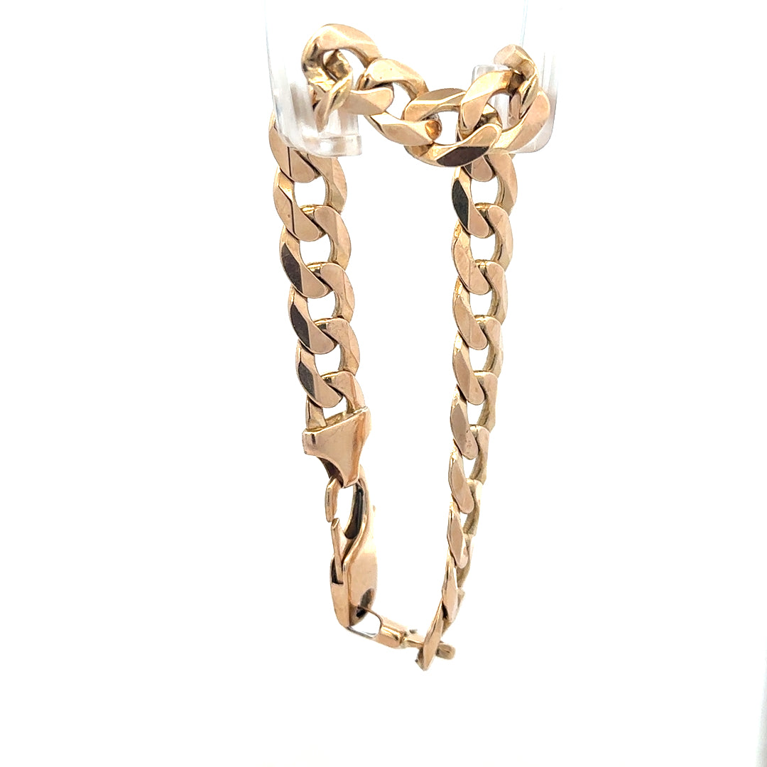 9ct yellow gold curb bracelet, unbranded, weighing 31.9g, featuring classic chain links, displayed on a plain background.