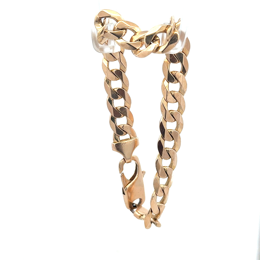 9ct yellow gold curb bracelet with a 31.9g weight, featuring a classic linked chain design and unbranded style.