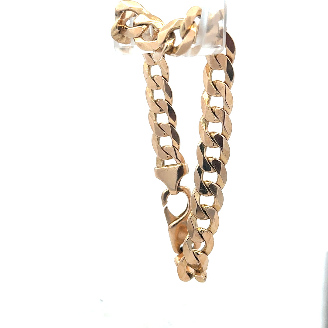 9ct yellow gold curb bracelet weighing 31.9g, unbranded, with a classic chain design and secure clasp.