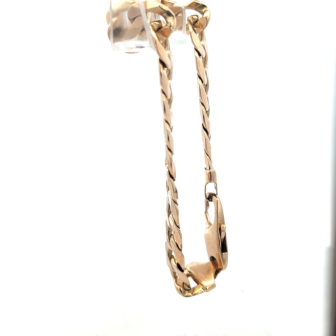 9ct yellow gold curb bracelet weighing 31.9g, unbranded, featuring a classic chain design with polished links.