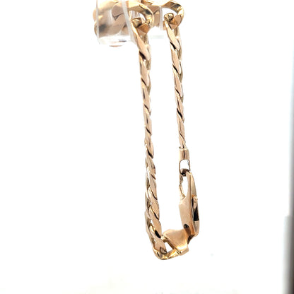 9ct yellow gold curb bracelet weighing 31.9g, unbranded, featuring a classic chain design with polished links.
