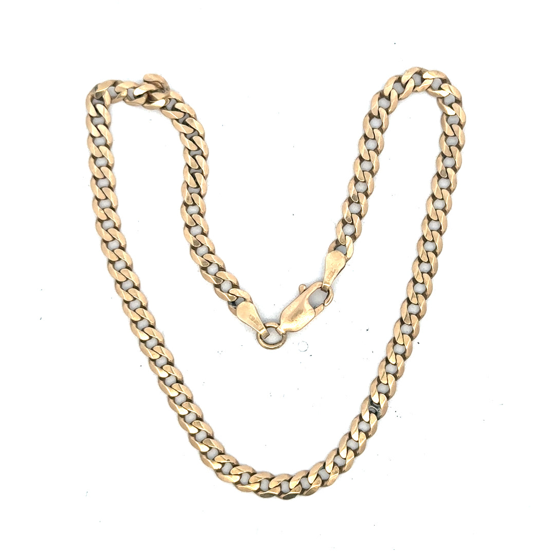 9ct yellow gold curb bracelet weighing 5.2g, showcasing a classic linked chain design with a polished finish.