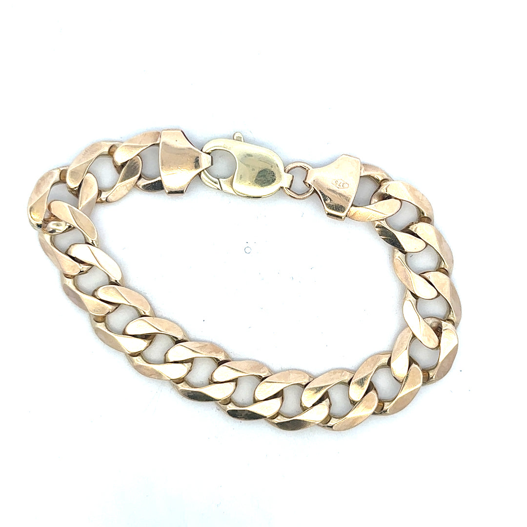 9ct yellow gold curb bracelet with a polished finish, weight 52.6g, showcasing a classic chain design.