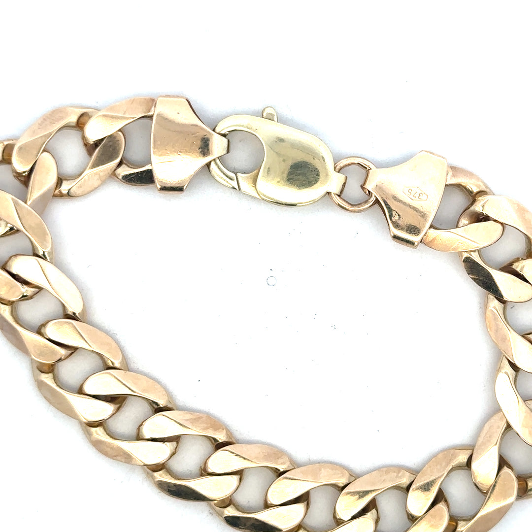 9ct yellow gold curb bracelet weighing 52.6g, unbranded, featuring classic linked chain design, visible in the product image.