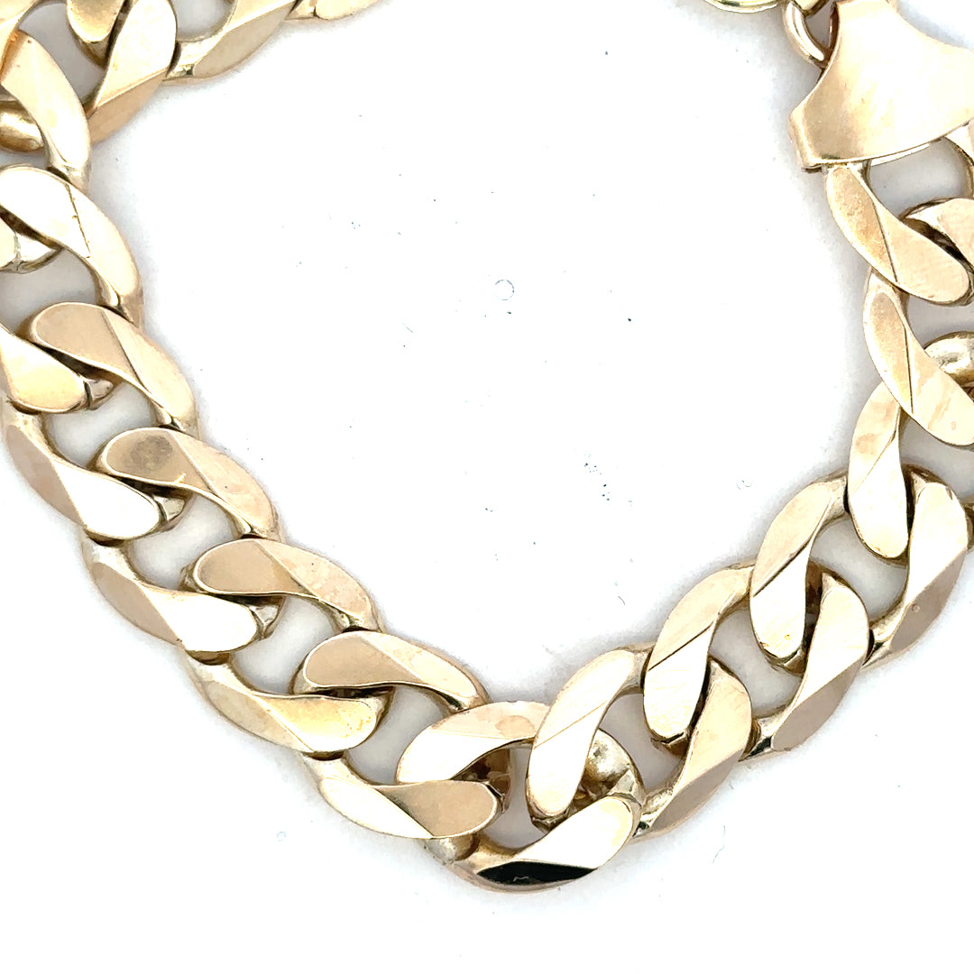 9ct yellow gold curb bracelet, unbranded, weighing 55g, featuring classic linked design with a polished finish.