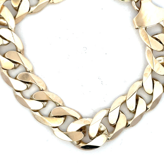 9ct yellow gold curb bracelet, unbranded, weighing 55g, featuring classic linked design with a polished finish.