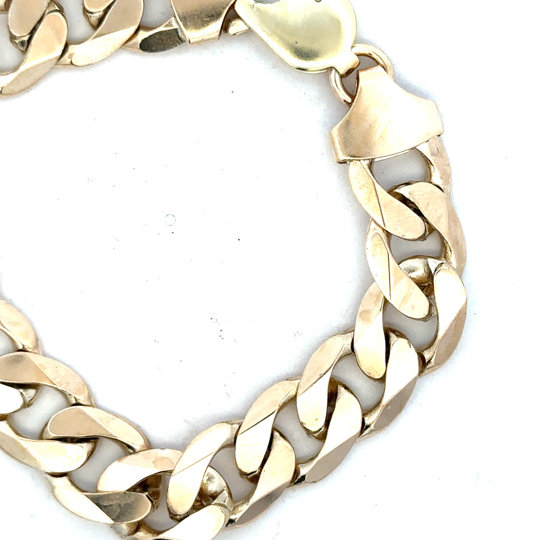 9ct yellow gold curb bracelet with a 55g weight, displayed on a neutral background, showcasing its linked chain design.