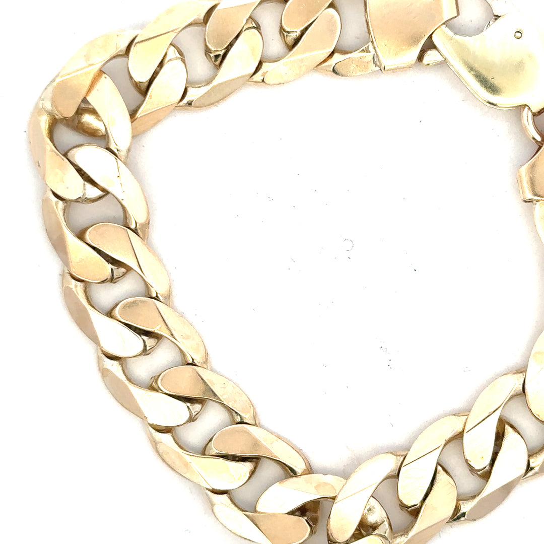9ct yellow gold curb bracelet weighing 55g, unbranded, with a classic linked chain design showing intricate gold links.