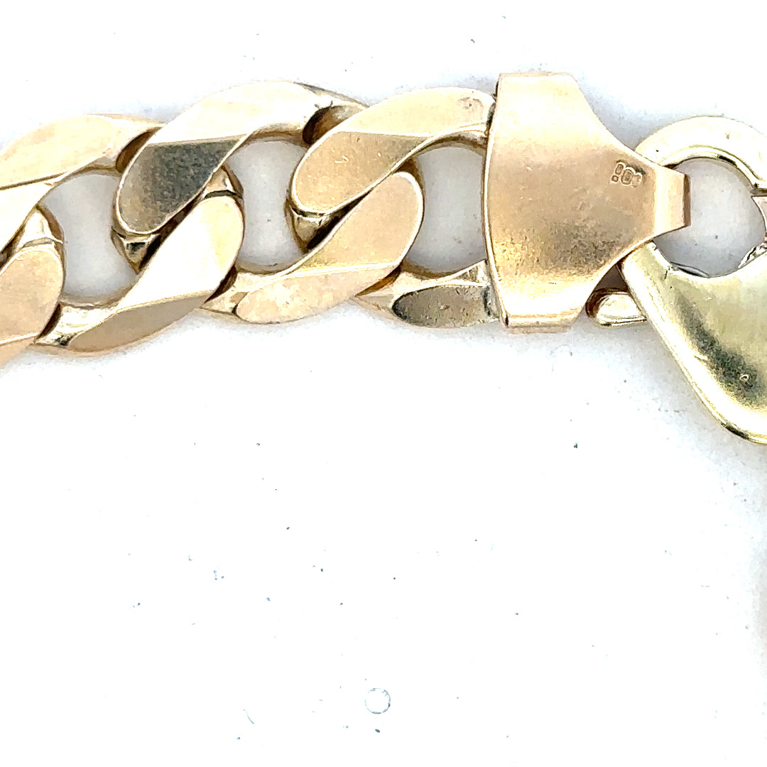 9ct yellow gold curb bracelet with a 55g weight, featuring a classic linked chain design. Perfect for elegant jewelry collection.