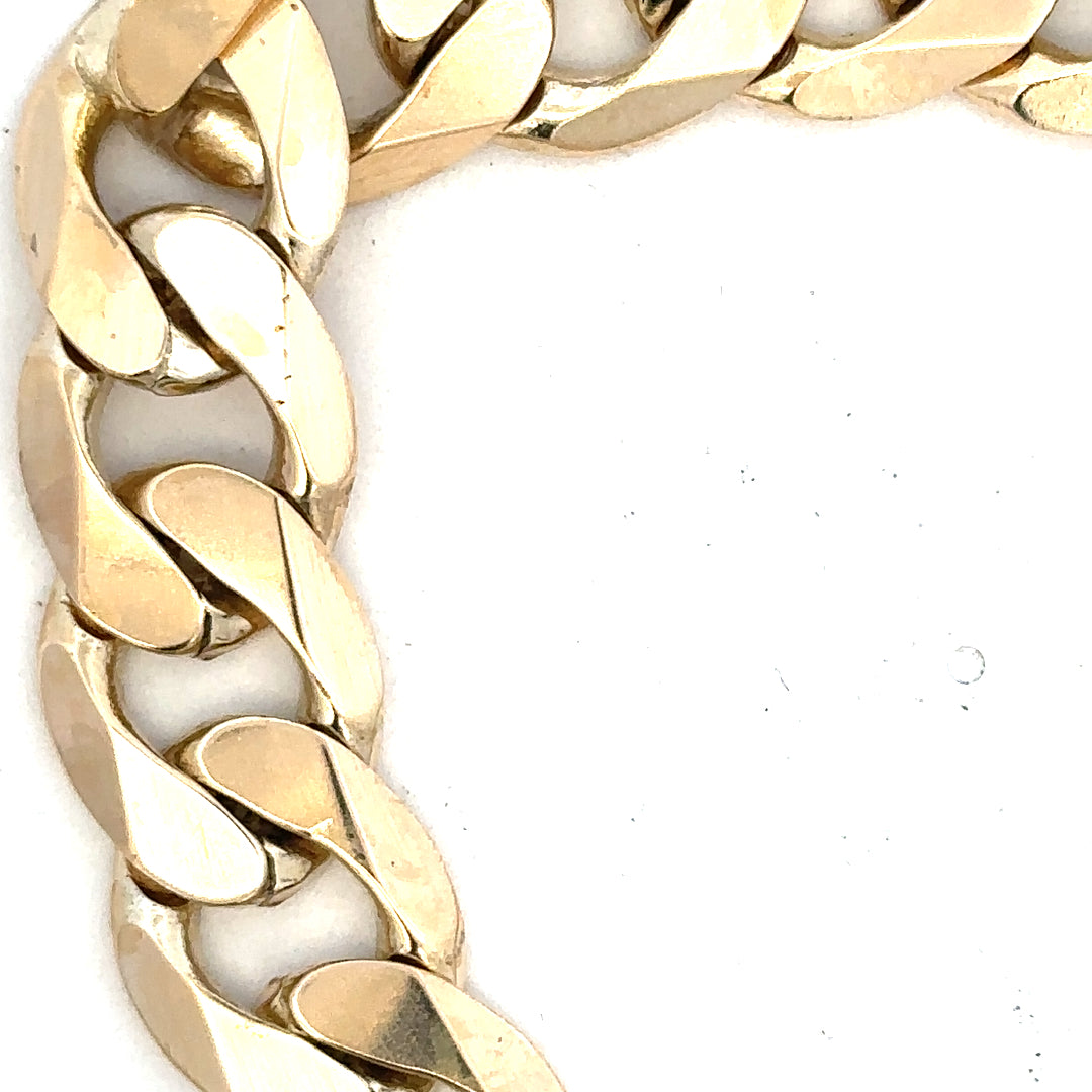 9ct yellow gold curb bracelet weighing 55g, unbranded, with a classic linked chain design visible in the image.