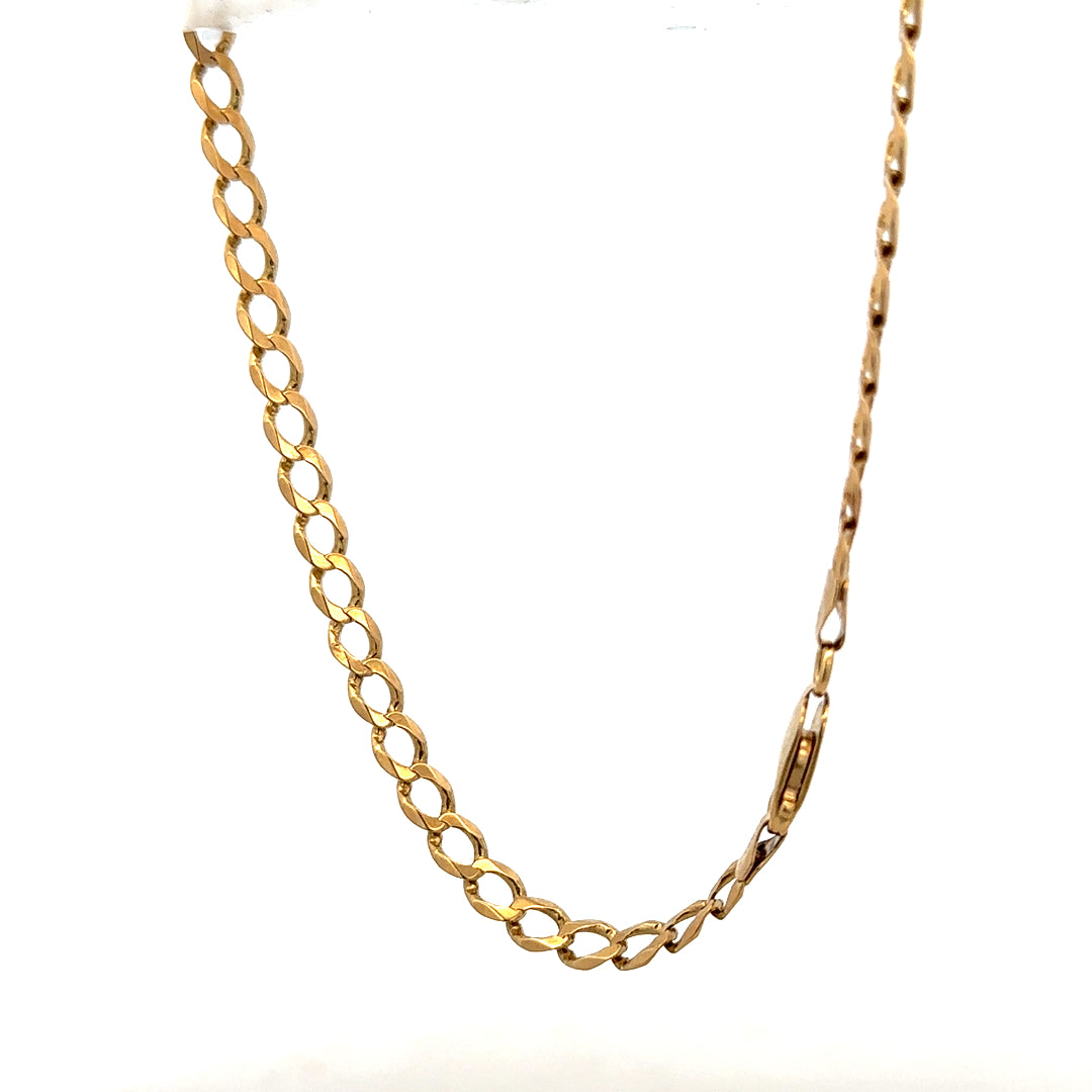 9ct yellow gold curb bracelet weighing 7.6g, featuring classic linked design, unbranded jewelry accessory in close-up view.