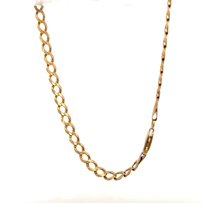 9ct yellow gold curb bracelet weighing 7.6g, featuring classic linked design, unbranded jewelry accessory in close-up view.
