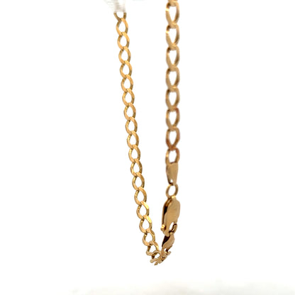 9ct yellow gold curb bracelet weighing 7.6g, unbranded jewelry with a classic chain design for women or men.