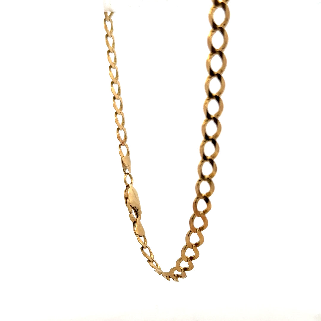 9ct yellow gold curb bracelet weighing 7.6g, unbranded, featuring classic chain links, shown on a neutral background.