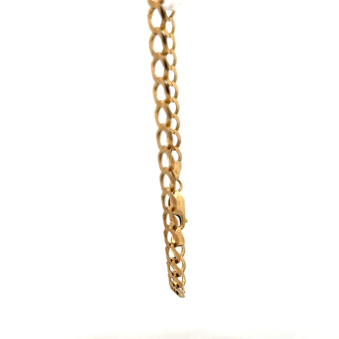 Yellow gold curb bracelet with a 7.6g weight, featuring classic linked design, unbranded jewelry accessory.