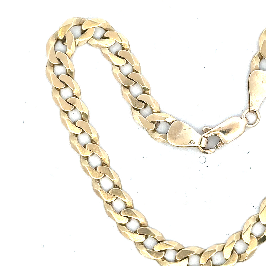 9ct yellow gold curb bracelet with a polished finish, weighing 8.3g, unbranded jewelry accessory displayed on a neutral background.