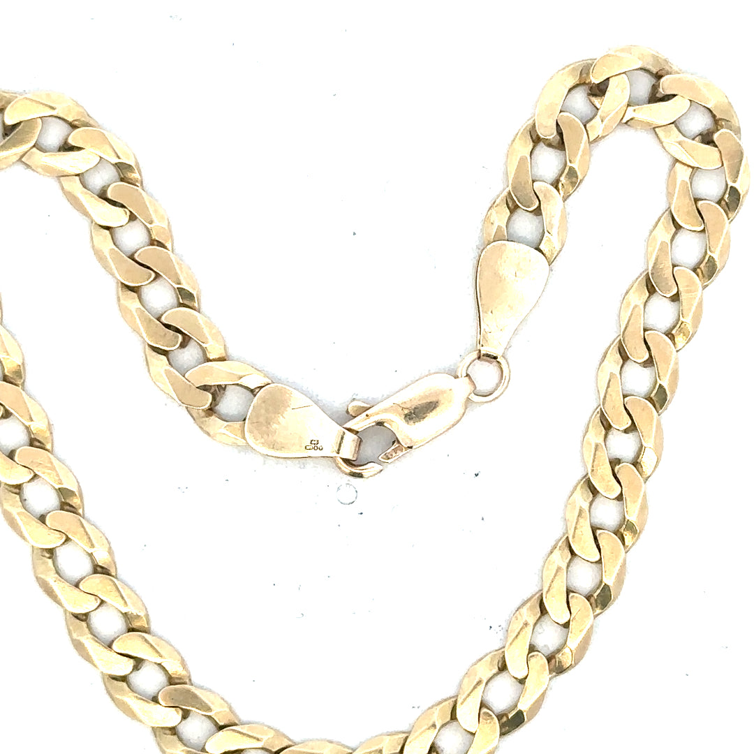 9ct yellow gold curb bracelet with a sleek link design, weighing 8.3 grams, showcasing fine craftsmanship.