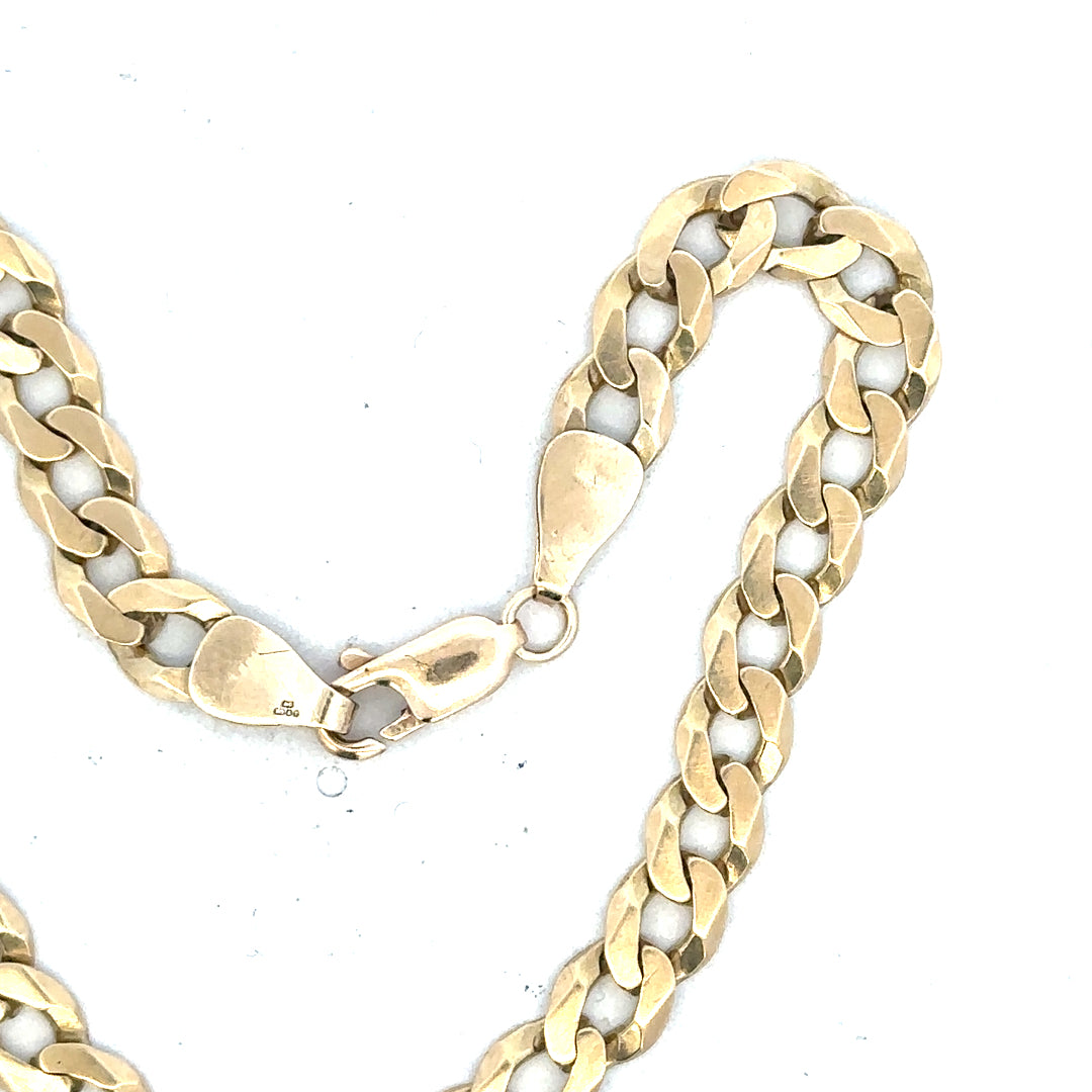 9ct yellow gold curb bracelet with an 8.3g weight, featuring classic linked design, unbranded jewelry accessory.