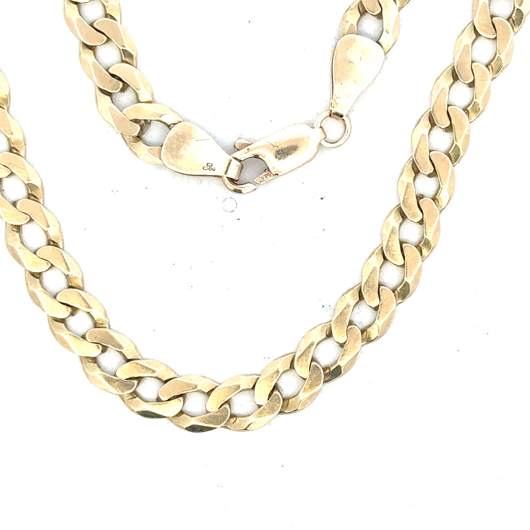 9ct yellow gold curb bracelet, unbranded, weighing 8.3g, showcasing a classic chain design on a neutral background.
