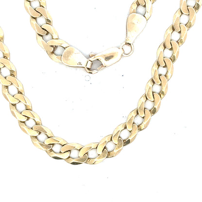 9ct yellow gold curb bracelet, unbranded, weighing 8.3g, showcasing a classic chain design on a neutral background.