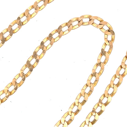 9ct yellow gold curb chain weighing 11.5g, unbranded jewelry chain with a classic curb link design.
