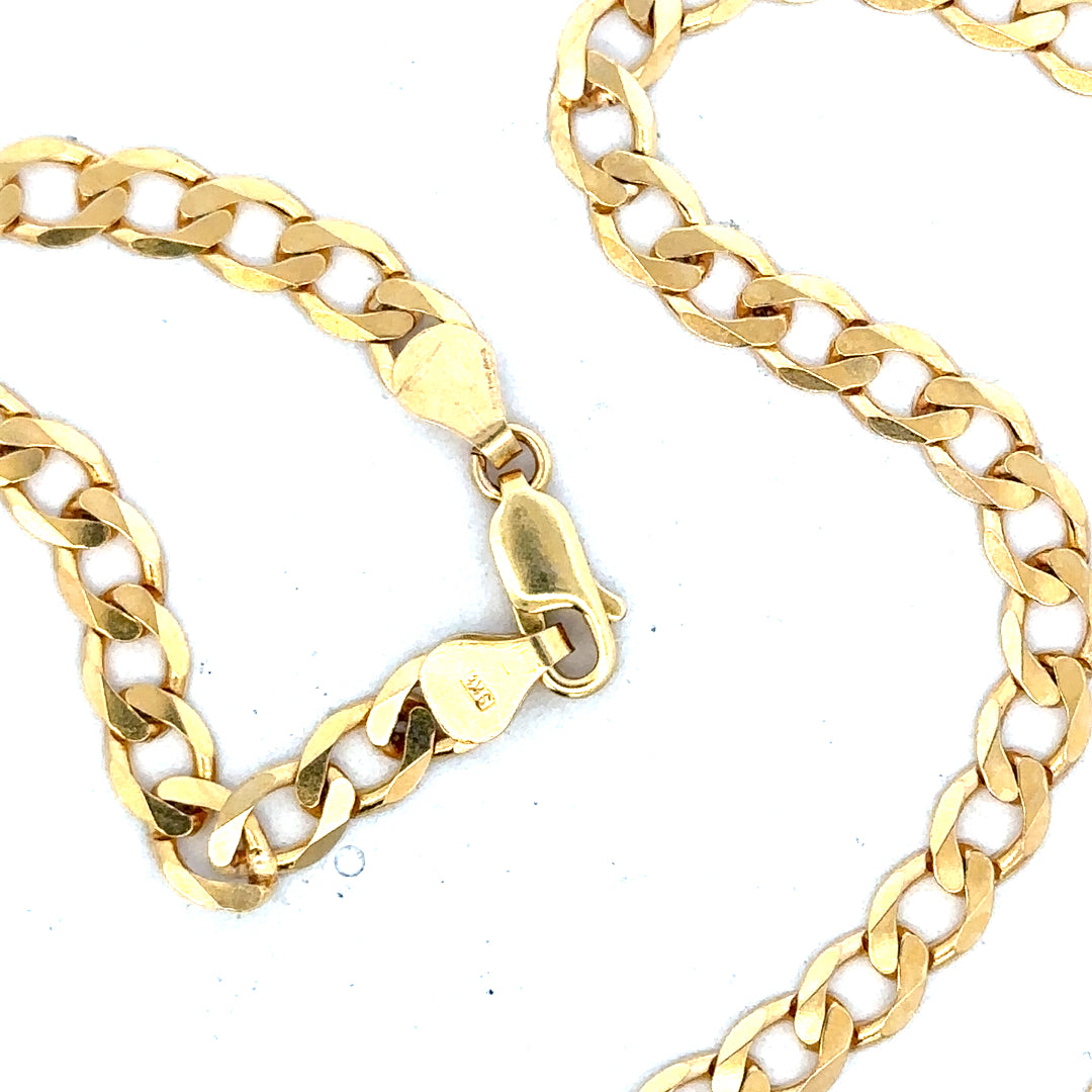 9ct yellow gold curb chain weighing 14.7g, unbranded jewelry chain with a classic curb link design.