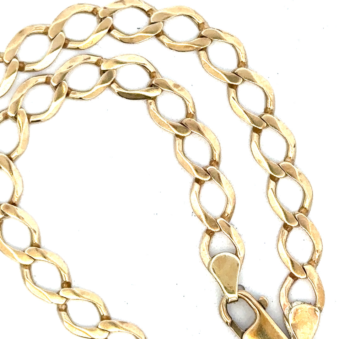 9ct yellow gold curb chain weighing 16.3g, unbranded jewelry chain with a classic link design, shown in close-up.