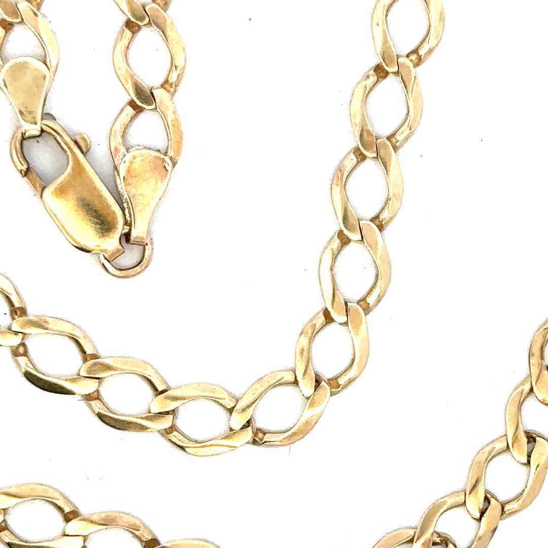 9ct yellow gold curb chain, unbranded, 16.3g, showcasing the detailed links and shiny finish of this elegant jewelry piece.