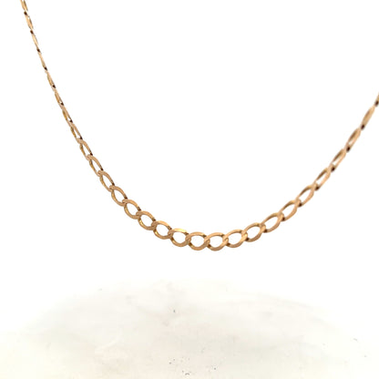 9ct yellow gold curb chain weighing 17.3g, featuring a classic design and polished finish, unbranded jewelry accessory.