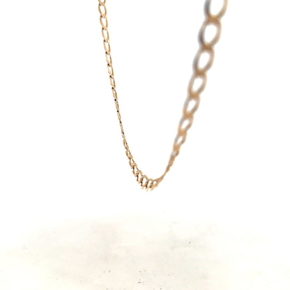 9ct yellow gold curb chain, unbranded, 17.3g, with detailed links, showcasing a classic jewelry chain design.