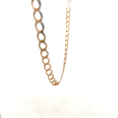 9ct yellow gold curb chain weighing 17.3g, unbranded jewelry chain with a classic curb link design.