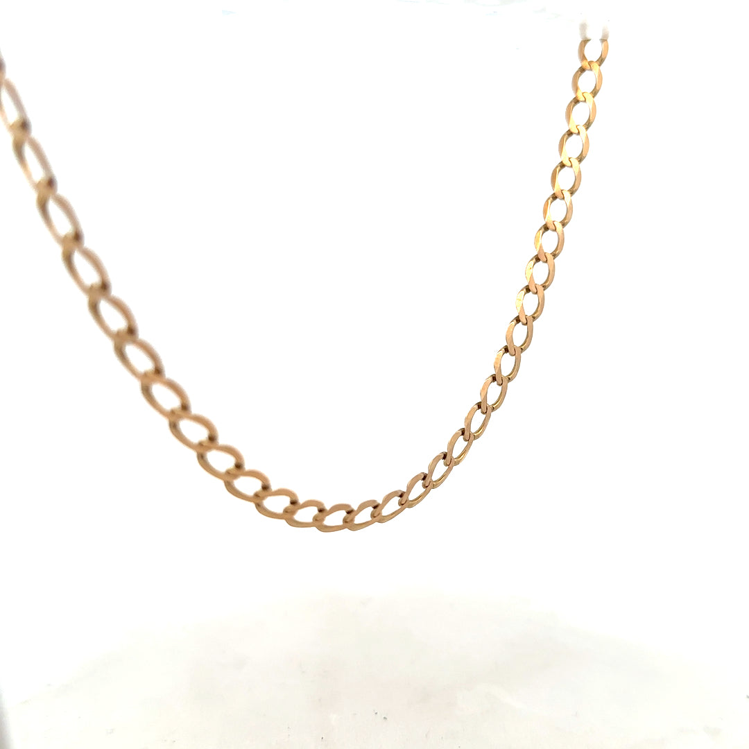 9ct yellow gold curb chain, unbranded, 17.3g, showing close-up of classic linked design and shiny gold finish.