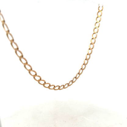 9ct yellow gold curb chain, unbranded, 17.3g, showing close-up of classic linked design and shiny gold finish.
