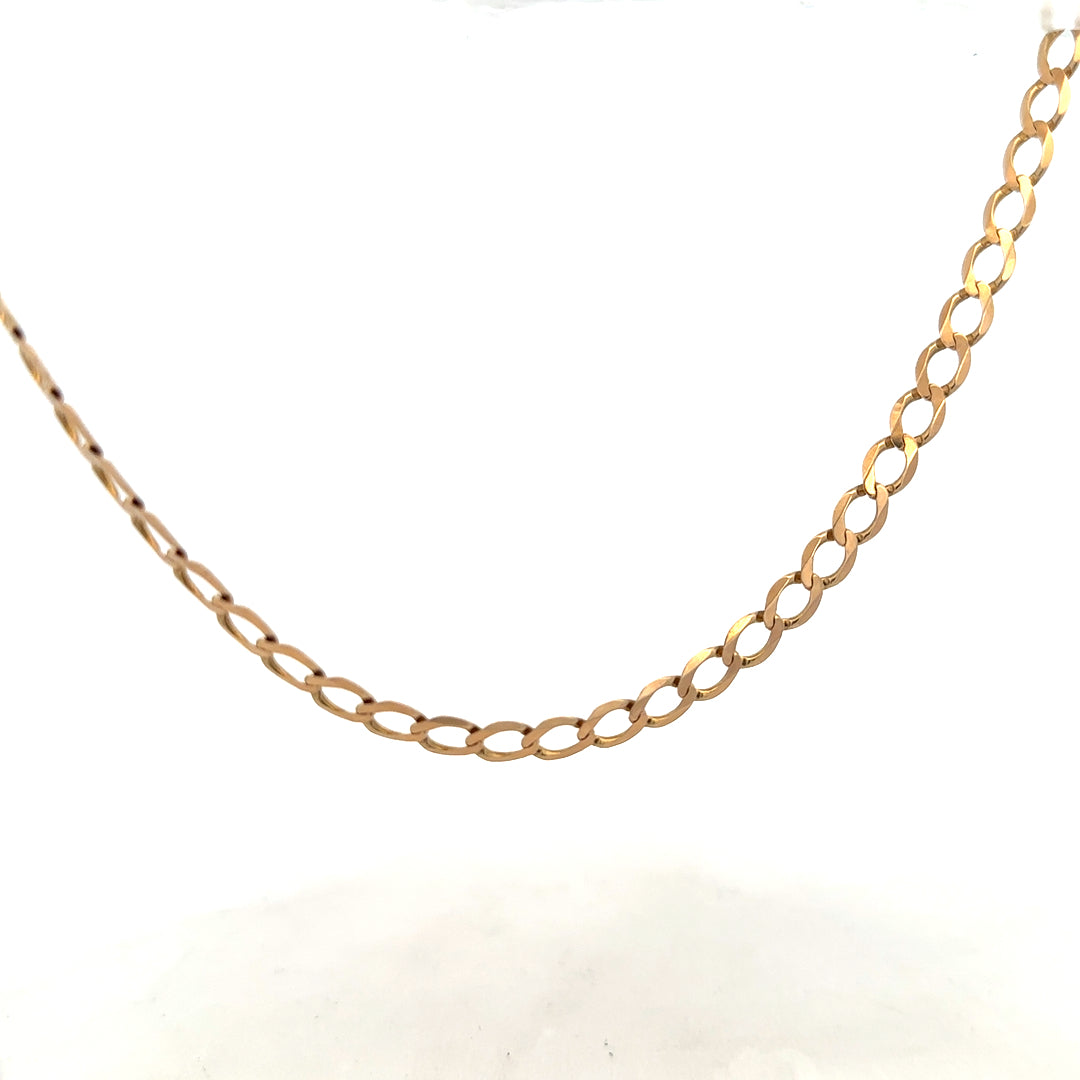 9ct yellow gold curb chain weighing 17.3g, unbranded jewelry chain with classic curb link design.