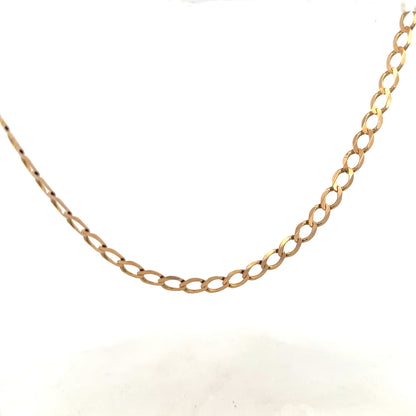 9ct yellow gold curb chain weighing 17.3g, unbranded jewelry chain with classic curb link design.