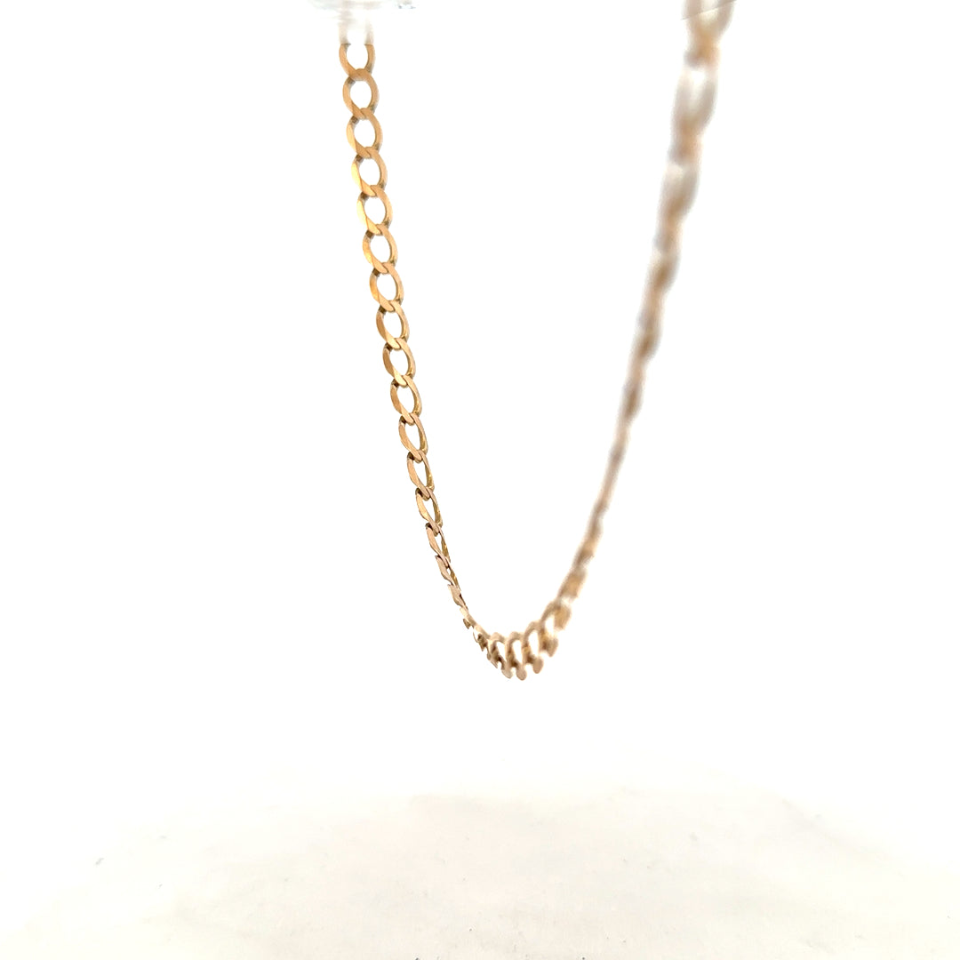 9ct yellow gold curb chain weighing 17.3g, unbranded jewelry chain with a classic curb link design, shown in close-up.