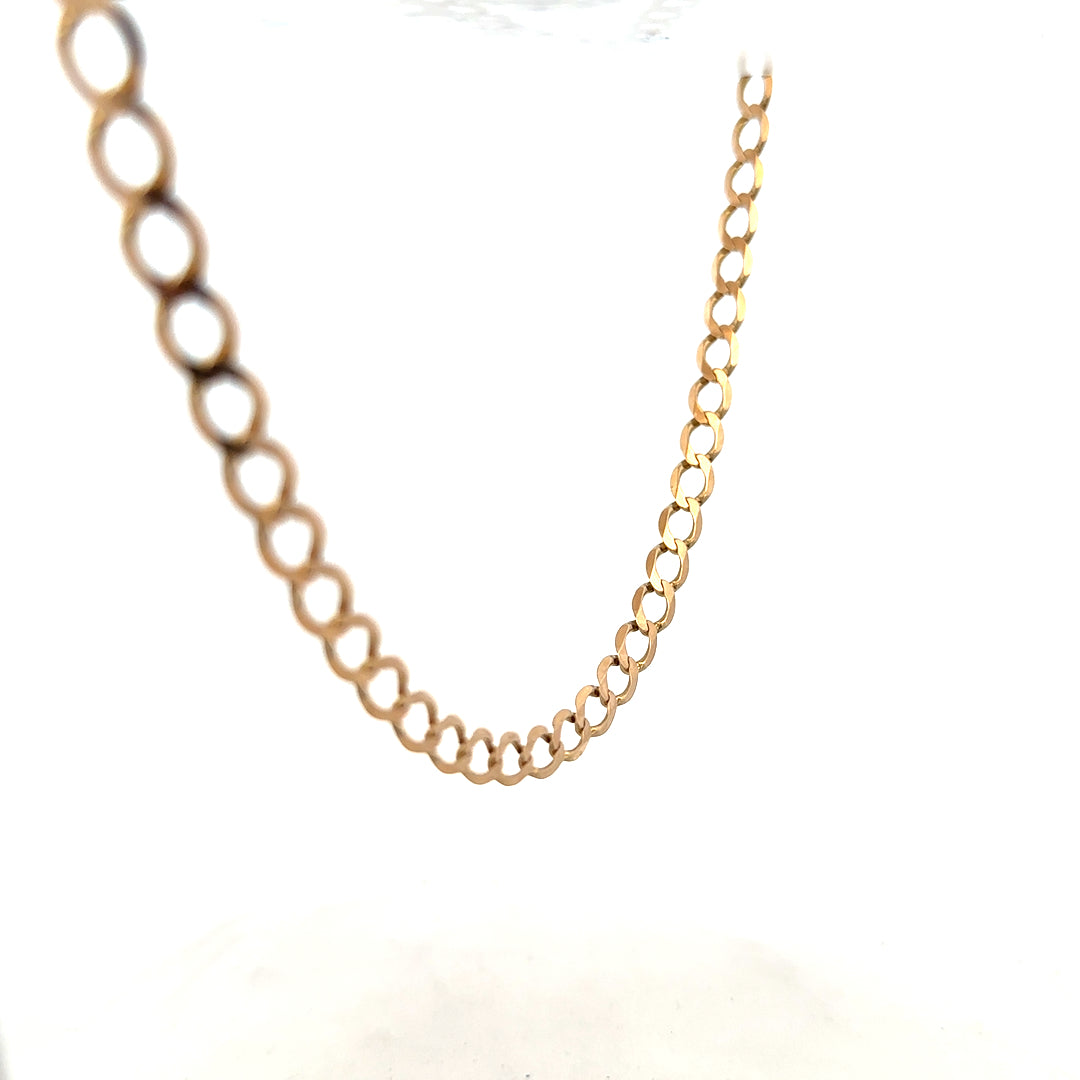 9ct yellow gold curb chain, unbranded, 17.3g, smooth interlinked design, showcasing shiny gold finish and durable craftsmanship.