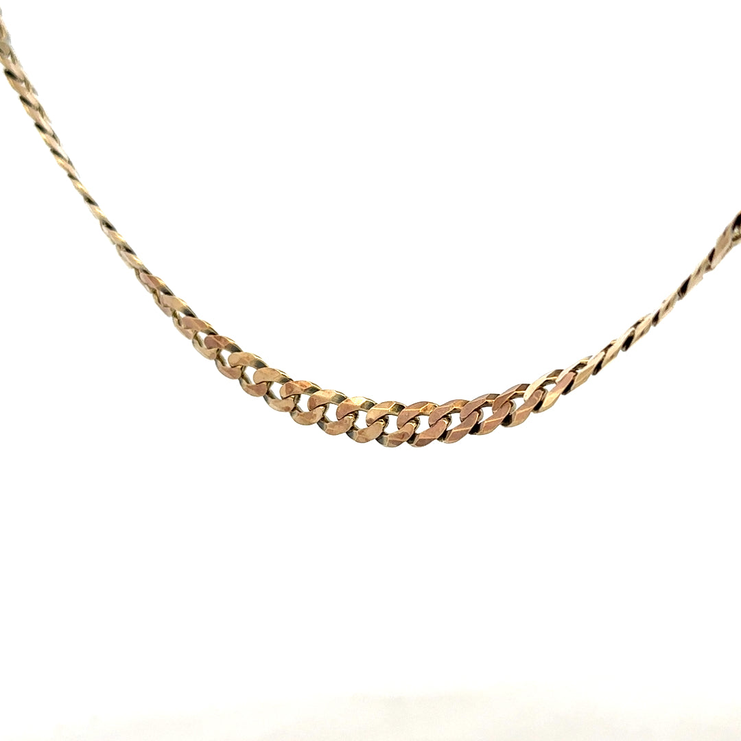 9ct yellow gold curb chain weighing 25.4g, unbranded jewelry chain with a classic curb link design.